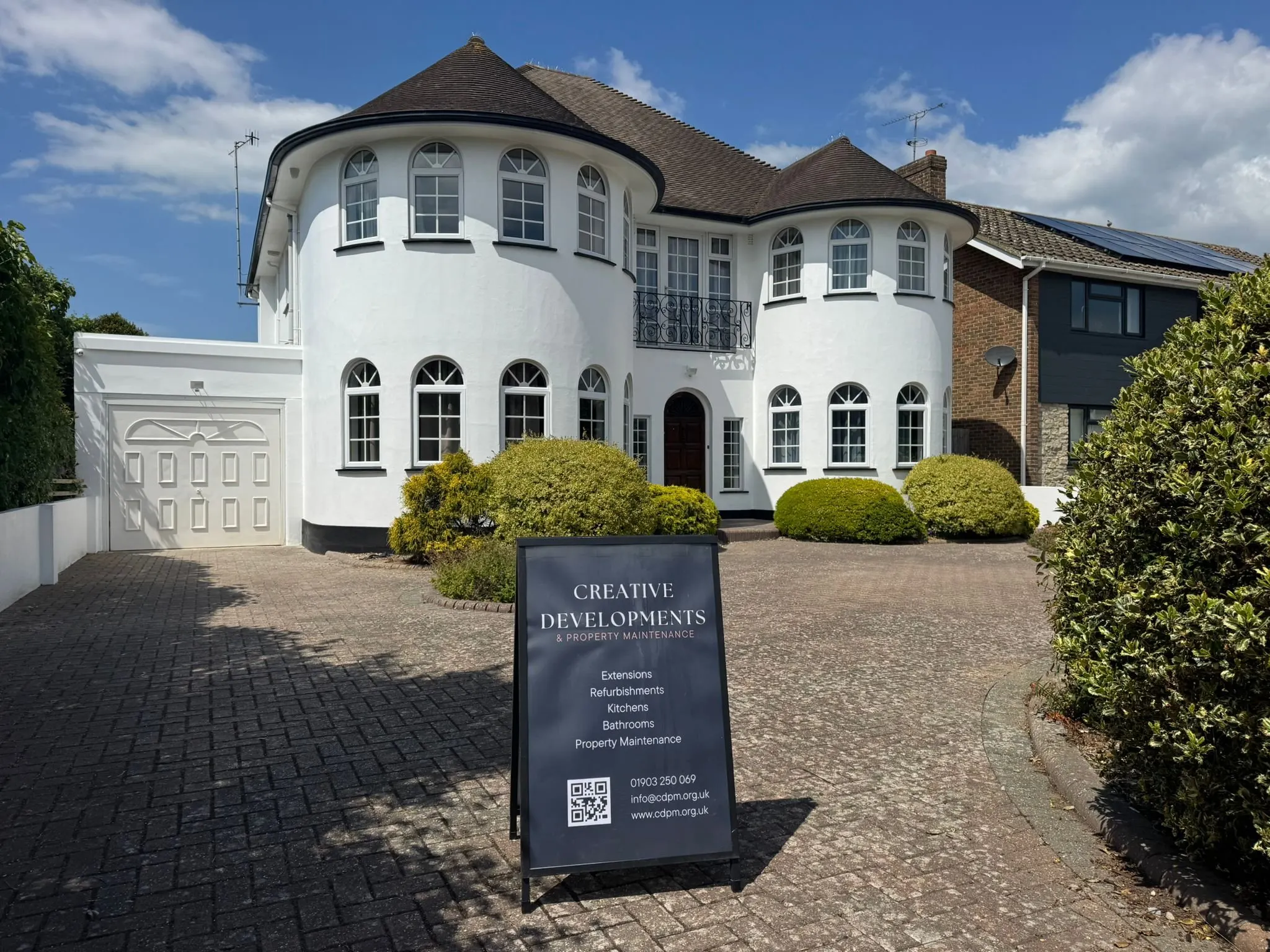 Creative Developments sign outside a freshly painted house
