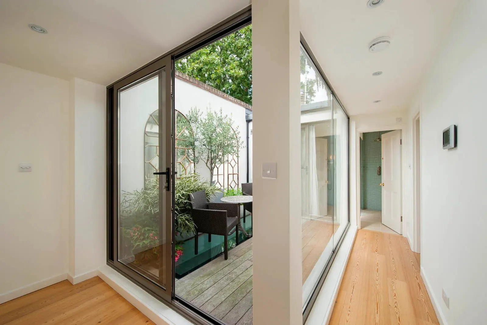 Renovated hallway with glass doors to the garden